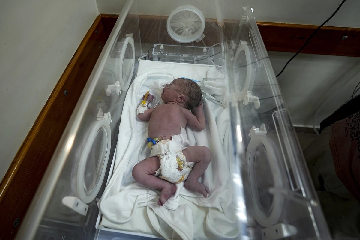 Baby Born from Dead Mother in Gaza
 - AP